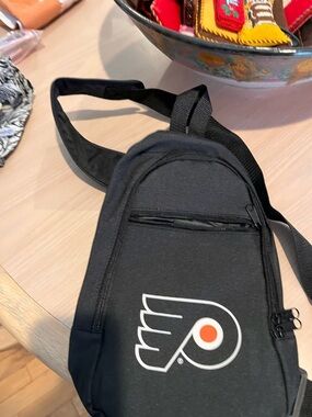 Black Sling Backpack with Team Logo